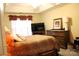 Comfortable bedroom features a patterned comforter, neutral walls, and a large window for ample natural light at 12205 Westbury Glen Ct # 17, Charlotte, NC 28262