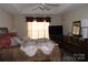 Spacious bedroom with large windows and a comfortable bed at 12205 Westbury Glen Ct # 17, Charlotte, NC 28262