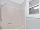 Bathroom with shower/tub combo and window at 12491 Oak Grove Rd, Stanfield, NC 28163