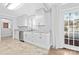 Updated kitchen with white cabinets, granite countertops, and backyard access at 12491 Oak Grove Rd, Stanfield, NC 28163