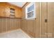 Simple kitchen with wood cabinets and window at 12491 Oak Grove Rd, Stanfield, NC 28163