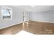 Spacious living area with hardwood floors and front entrance at 12491 Oak Grove Rd, Stanfield, NC 28163