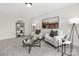 Cozy living room with plush armchairs, decorative lamps, and a modern bookcase at 13019 Arnold Palmer Cir # 832, Lancaster, SC 29720