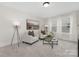 Cozy living room with plush armchairs, decorative lamps, and large windows providing natural light at 13019 Arnold Palmer Cir # 832, Lancaster, SC 29720