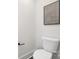 A toilet in a bathroom with white walls and black hardware at 13019 Arnold Palmer Cir # 832, Lancaster, SC 29720