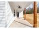 An outdoor living space with wooden beams, concrete flooring, and a ceiling fan at 1306 Eddie St, Gastonia, NC 28054