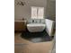 Modern bathroom with a freestanding tub and hexagon tile at 1306 Eddie St, Gastonia, NC 28054