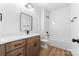 Neutral bathroom with single vanity and tub/shower combo at 1306 Eddie St, Gastonia, NC 28054