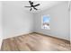 Bright bedroom features one large window, ceiling fan, and light wood-look flooring at 1306 Eddie St, Gastonia, NC 28054