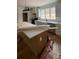 A modern kitchen with white cabinets, quartz countertops, and a farmhouse sink at 1306 Eddie St, Gastonia, NC 28054