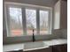 Modern farmhouse kitchen sink with a black gooseneck faucet and white quartz countertops at 1306 Eddie St, Gastonia, NC 28054