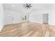 Spacious living room featuring light-colored hardwood floors, high ceilings, and a modern ceiling fan at 1306 Eddie St, Gastonia, NC 28054