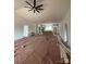 Spacious living room with high ceilings and ceiling fan; currently under construction at 1306 Eddie St, Gastonia, NC 28054