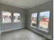 Bright living room with lots of windows and wood-look floors offers a welcoming space at 1308 Walter Taylor Way # Eqx0105, Charlotte, NC 28206