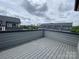 Spacious rooftop deck with views of the city skyline and surrounding townhomes at 1308 Walter Taylor Way # Eqx0105, Charlotte, NC 28206