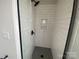 Modern shower stall featuring white subway tile, black hardware and a built-in shelf at 1308 Walter Taylor Way # Eqx0105, Charlotte, NC 28206