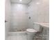 Clean bathroom with a tiled shower and pedestal sink at 152 Woodlynn Dr, Charlotte, NC 28214