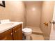 Basement bathroom with shower stall, toilet, and vanity at 152 Woodlynn Dr, Charlotte, NC 28214