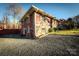 Brick house with a stone facade and a gravel driveway at 152 Woodlynn Dr, Charlotte, NC 28214