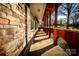 Covered porch with brick and stone details at 152 Woodlynn Dr, Charlotte, NC 28214