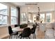 Modern dining room with oval table and kitchen view at 1607 Polk St # Eqx0210, Charlotte, NC 28206