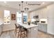 Modern kitchen with island, stainless steel appliances, and white cabinets at 1607 Polk St # Eqx0210, Charlotte, NC 28206