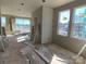 Unfinished living room with drywall and large windows at 1607 Polk St # Eqx0210, Charlotte, NC 28206