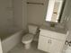 Bathroom featuring a tub, toilet, and vanity with a sink, offering a functional design at 1611 Polk St # Eqx0209, Charlotte, NC 28206