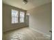 Bedroom with natural light, neutral walls, and new floors, creating a serene atmosphere at 1611 Polk St # Eqx0209, Charlotte, NC 28206
