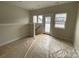 Upstairs bonus room with natural light and neutral paint, awaiting your personal touch at 1611 Polk St # Eqx0209, Charlotte, NC 28206