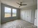 Bedroom featuring two large windows, allowing for ample natural light, and a double-door closet at 1615 Polk St # Eqx0208, Charlotte, NC 28206
