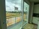 Balcony view toward city and adjacent new construction at 1619 Polk St # Eqx0207, Charlotte, NC 28206