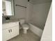 A clean bathroom features a vanity with solid surface countertop and shower and tub combo at 1619 Polk St # Eqx0207, Charlotte, NC 28206