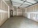 This unfinished garage features an automatic garage door and water heater at 1619 Polk St # Eqx0207, Charlotte, NC 28206