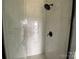 Shower with modern tile, sleek fixtures, and a glass enclosure at 1619 Polk St # Eqx0207, Charlotte, NC 28206