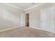 Spacious bedroom with neutral walls and carpeting at 2491 Seagull Dr, Denver, NC 28037