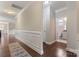 Elegant hallway with wainscoting and hardwood floors at 2491 Seagull Dr, Denver, NC 28037