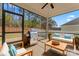 Relaxing screened porch with patio furniture and grill at 2491 Seagull Dr, Denver, NC 28037