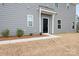 Gray siding townhome with private back entrance and small landscaping at 2795 Yeager Nw Dr, Concord, NC 28027