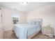 Bright bedroom with a double bed, nightstands and window at 2795 Yeager Nw Dr, Concord, NC 28027