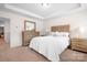 Bedroom with light wood dresser and bed, neutral decor at 2795 Yeager Nw Dr, Concord, NC 28027