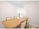 View of dining area with six chairs and a light wood table at 2795 Yeager Nw Dr, Concord, NC 28027