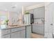 Modern kitchen with gray cabinets, granite countertops, and stainless steel appliances at 2795 Yeager Nw Dr, Concord, NC 28027