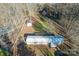 Aerial view of single-wide mobile home, detached shed, and large yard at 3586 Bridle Path Dr, Vale, NC 28168