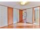 Simple bedroom with wood-look floors and floral wallpaper at 3586 Bridle Path Dr, Vale, NC 28168