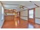 Living room with wood-look floors and breakfast bar at 3586 Bridle Path Dr, Vale, NC 28168