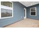 Covered back porch with blue siding and white trim at 40242 Crooked Stick Dr # 1198, Lancaster, SC 29720