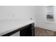 Bright laundry room with dark cabinets and white countertop at 40242 Crooked Stick Dr # 1198, Lancaster, SC 29720