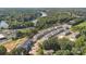 Aerial view of community near lake, featuring townhomes and apartments at 4455 Reed Creek Dr # 102, Sherrills Ford, NC 28673