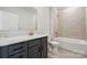 Bathroom with gray vanity, quartz countertop and bathtub at 4455 Reed Creek Dr # 102, Sherrills Ford, NC 28673